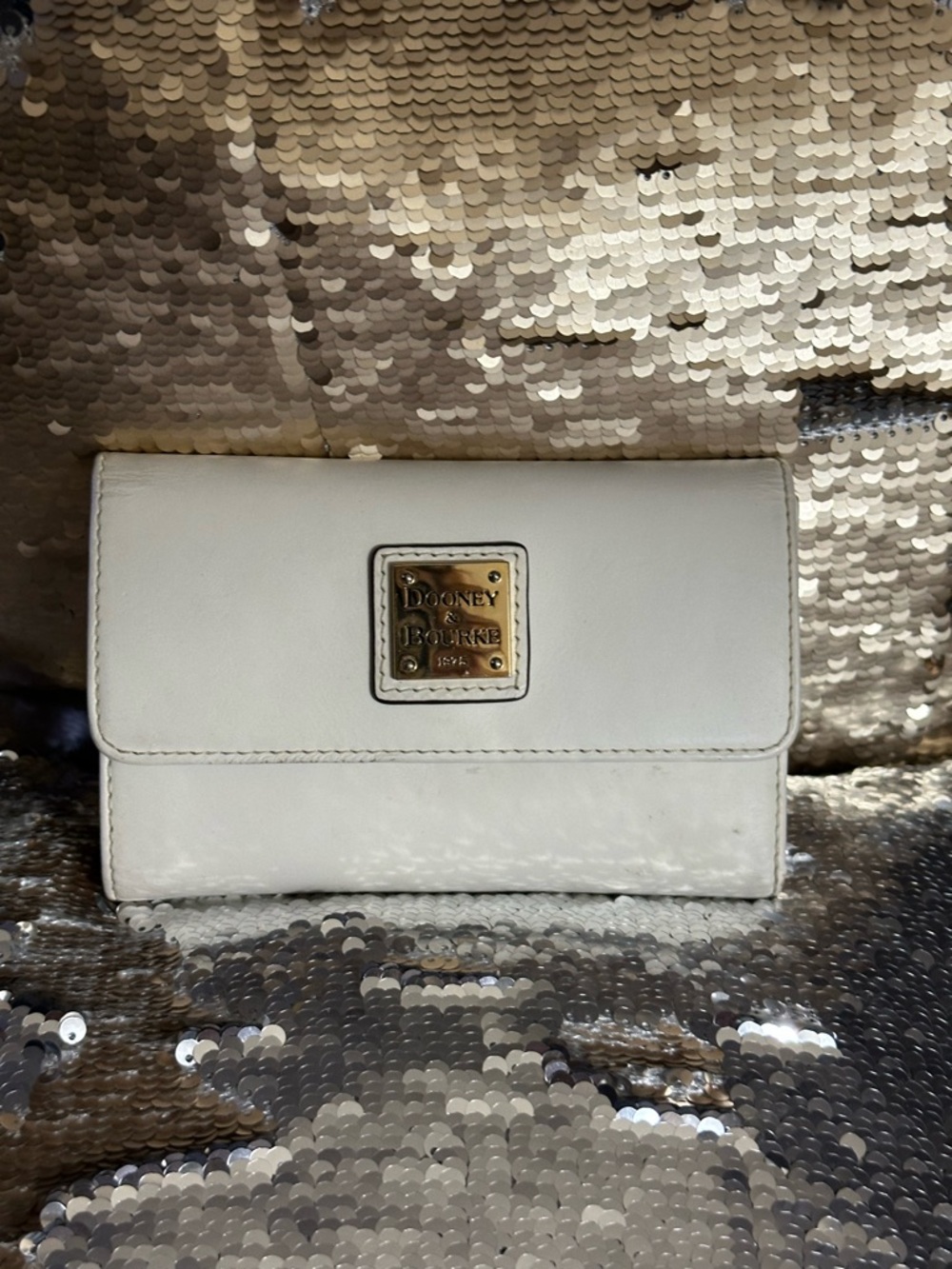 Dooney & Bourke Cream Leather Trifold Wallet with Gold Plaque